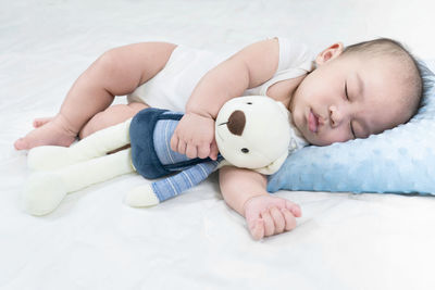 Cute baby sleeping on bed