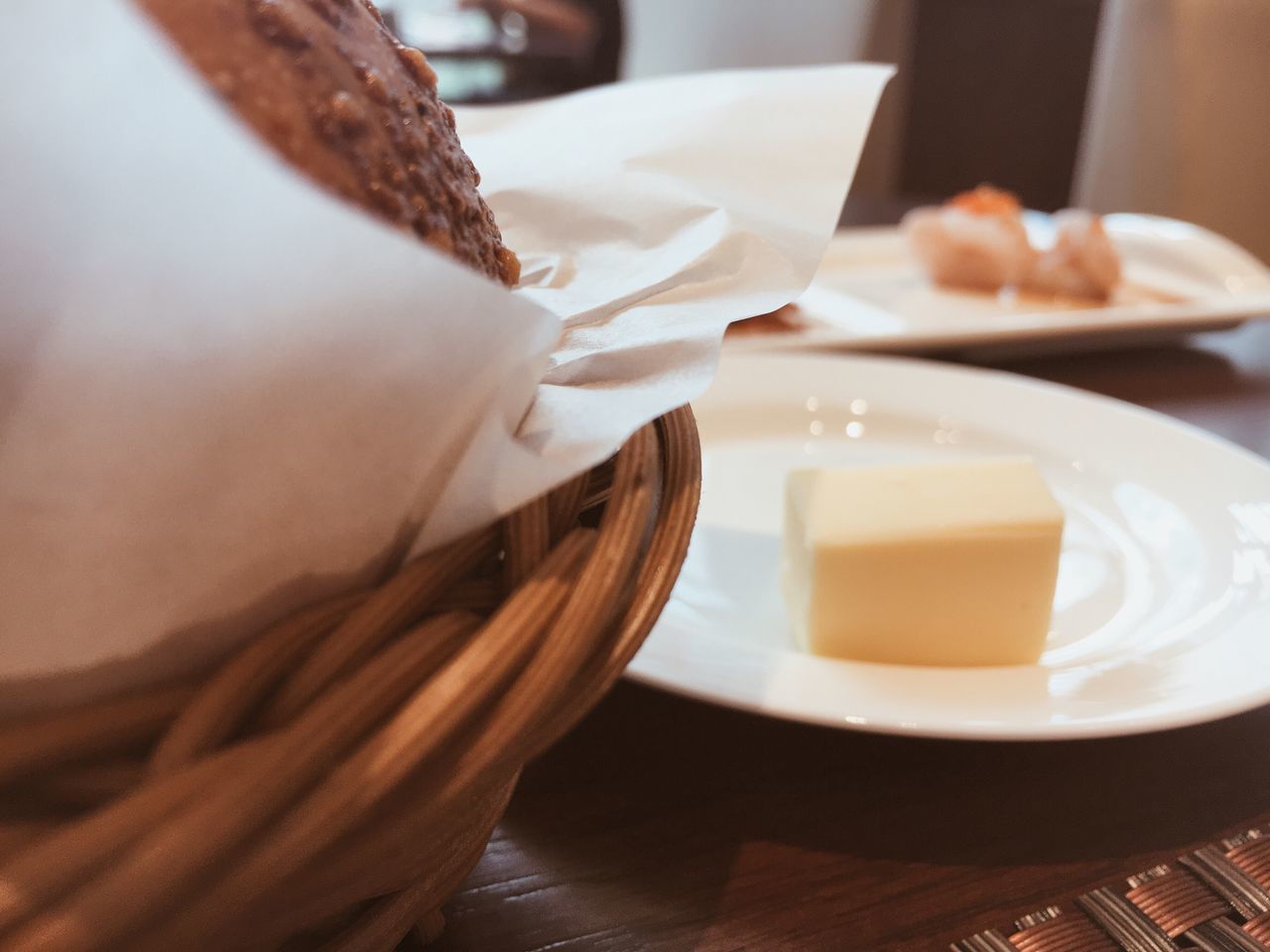 food and drink, indoors, freshness, holding, food, person, table, coffee cup, close-up, drink, indulgence, coffee - drink, sweet food, selective focus, personal perspective, unhealthy eating, focus on foreground, coffee break, ready-to-eat, beverage