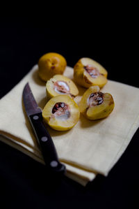 Close-up of fruits on napkin