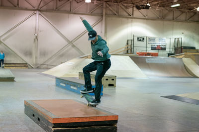 Full length of man skateboarding on skateboard