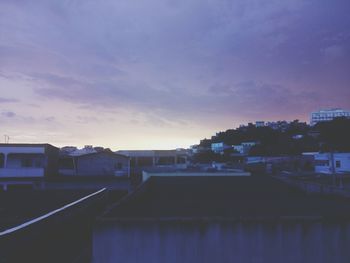 City against sky at sunset