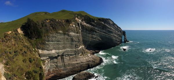 Scenic view of sea against clear blue sky