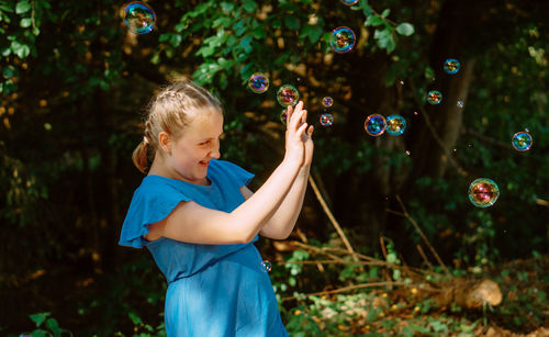 Girl with soap bubbles