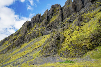 Low angle view of beautiful rock formations on volcanic landscape against sky