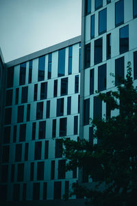 Low angle view of modern building against sky in city
