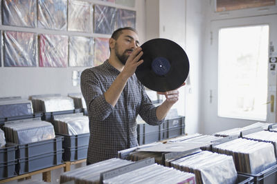 Young man shopping for records