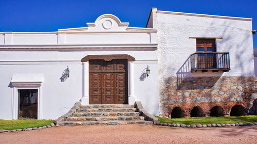 Exterior of old building against blue sky