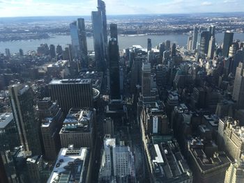 High angle view of modern buildings in city against sky