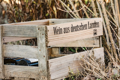 Text on wooden fence on field