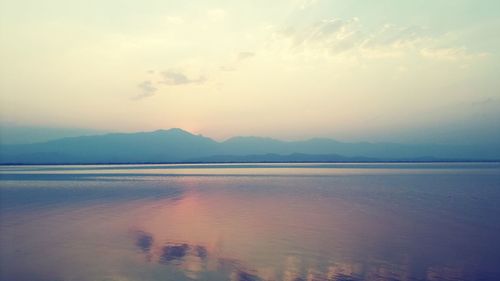 Scenic view of lake against sky during sunset