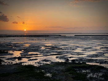 Scenic view of sea against sky during sunset