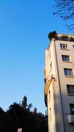 Low angle view of building against clear blue sky