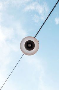 Low angle view of street light against sky