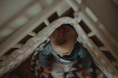 Rear view of child at home