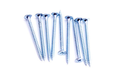 Close-up of metallic objects against white background