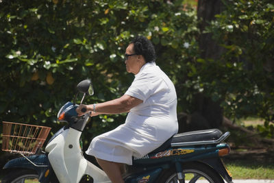 Side view of man riding bicycle