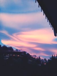 Silhouette trees against sky during sunset