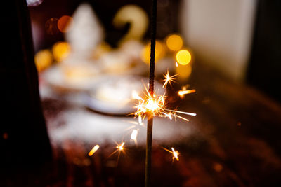 Close-up of sparkler at night