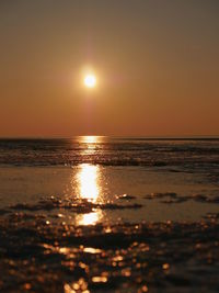 Scenic view of sea against sky at sunset