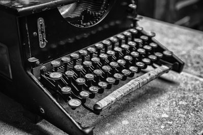 Close-up of old typewriter on table