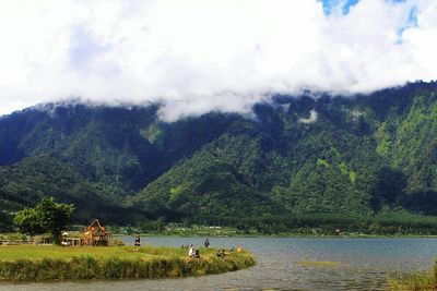 Scenic view of mountains against cloudy sky