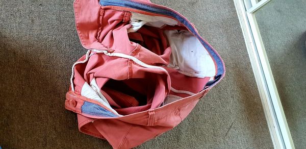 Directly above shot of woman with pink umbrella