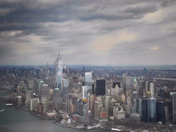 Cityscape against cloudy sky