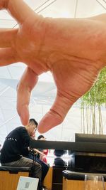 Rear view of people looking at camera