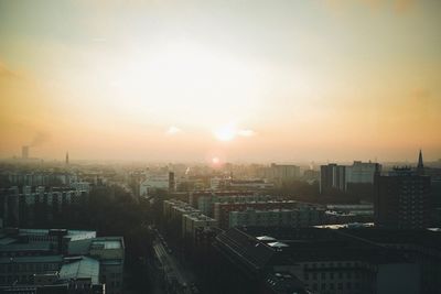 High angle view of buildings against sky during sunset