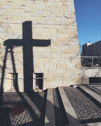 Shadow of a building on the wall