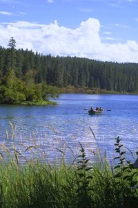 Scenic view of lake against cloudy sky
