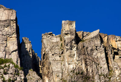 Low angle view of fort against clear blue sky