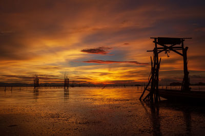 Scenic view of sea against orange sky