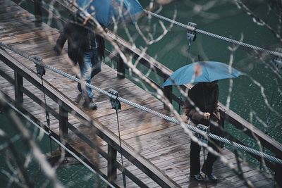 High angle view of people on bridge in city