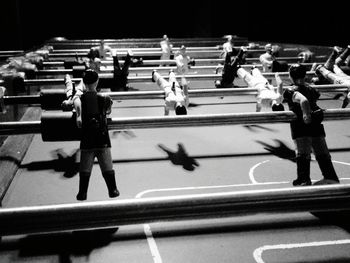 High angle view of foosball at illuminated room