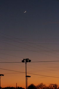 Low angle view of moon against sky during sunset