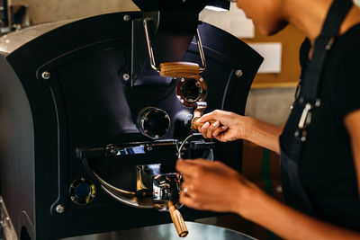 Close-up of man working with coffee