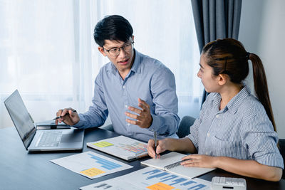 Business colleagues working at office