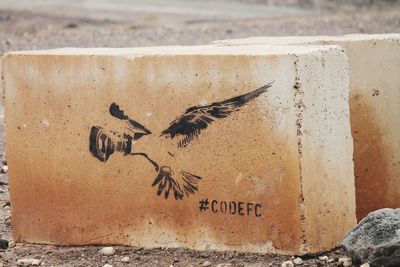 Close-up of text on wall