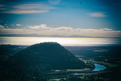 Scenic view of landscape against sky at sunset