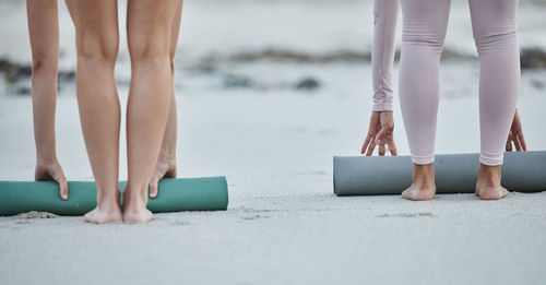 Low section of people walking on floor