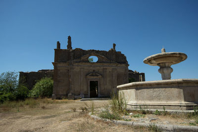 The octagonal fountain in front of the church of san bonaventura. it is local in ghost city,viterbo.