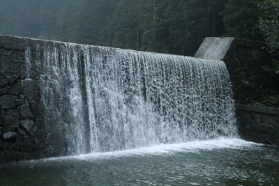 View of waterfall in forest