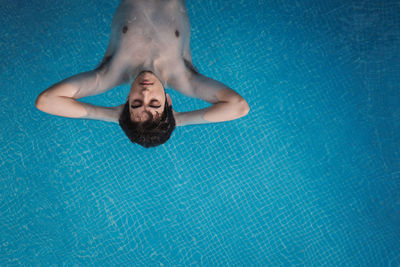 High angle view of man swimming in pool