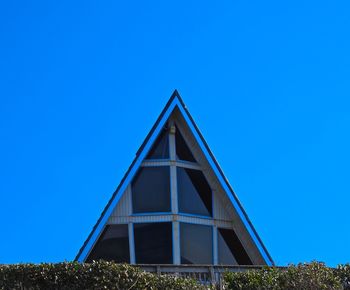 Low angle view of built structure against clear blue sky