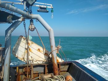 Ship on sea against blue sky