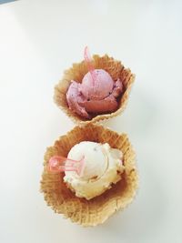 High angle view of cupcakes against white background