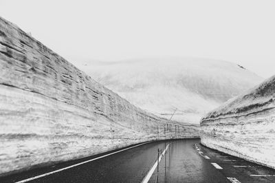 Road amidst landscape against clear sky