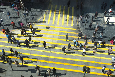 High angle view of people crossing road