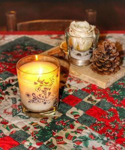 Close-up of tea light candles on table
